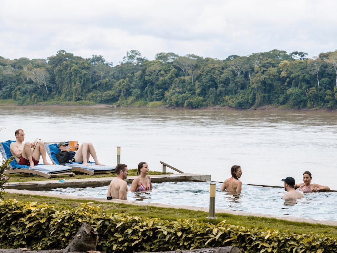Tour group enjoying swimming pool in Peru