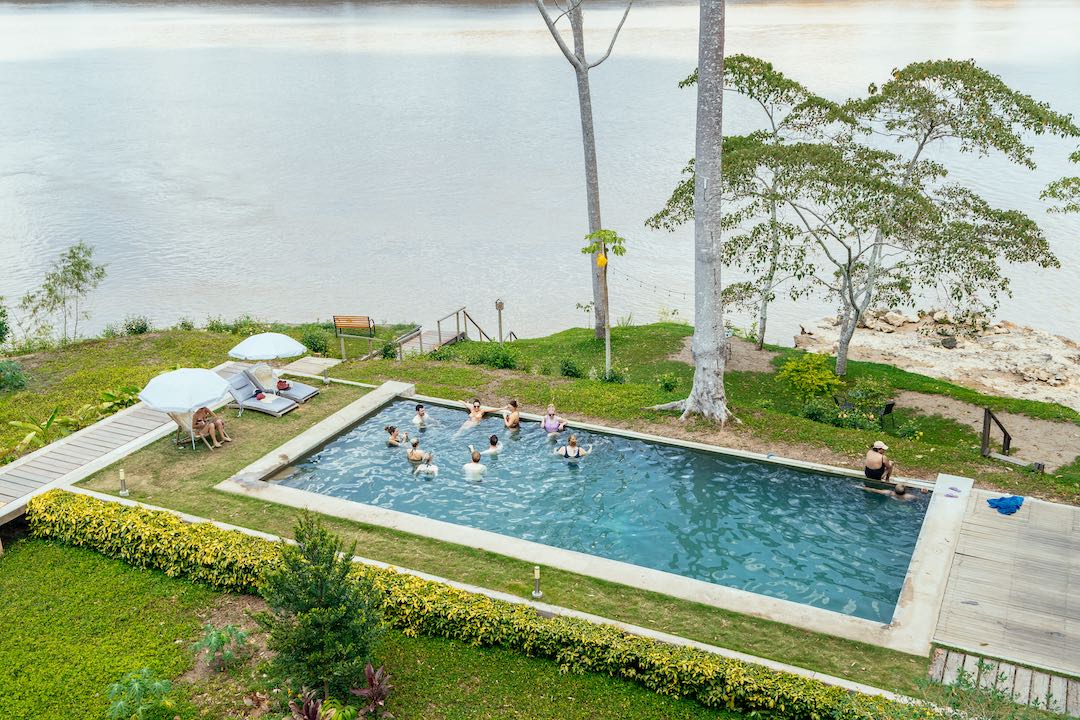 peru-amazon-1 Other Way Round Travel group in swimming pool in Amazon, Peru