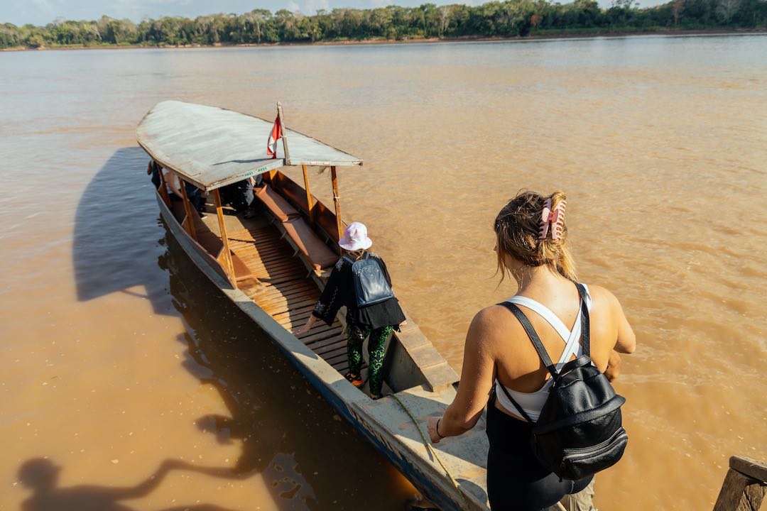 peru-amazon-3 Getting into a river boat in the Amazon Peru