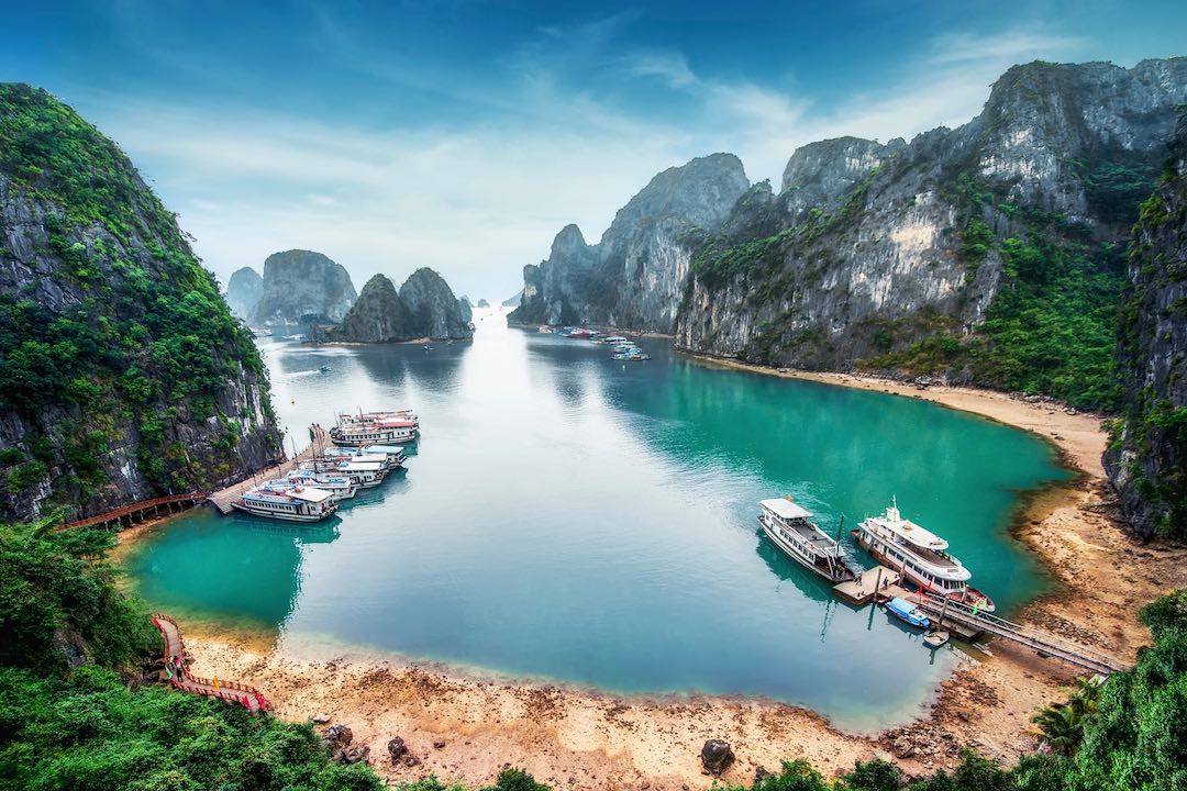 Tourist,Junks,Floating,Among,Limestone,Rocks,At,Ha,Long,Bay, Ha Long Bay Vietnam during our 15 day group tour of vietnam and cambodia