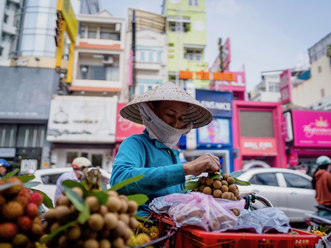 vietnam-cambodia-group-tour-1-1 Street vendor in Hanoi during a vietnam and cambodia group tour