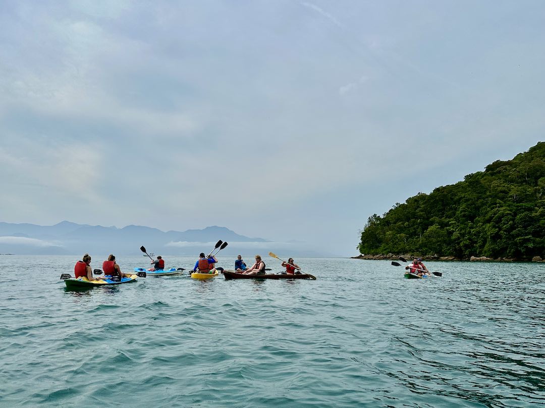 Other Way Round travel group kayaking in Ilha Grande, Brazil