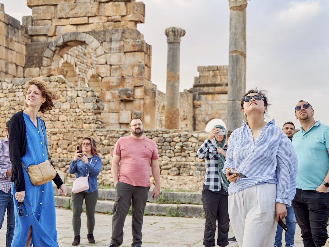 Group tour visiting Volubilis Morocco