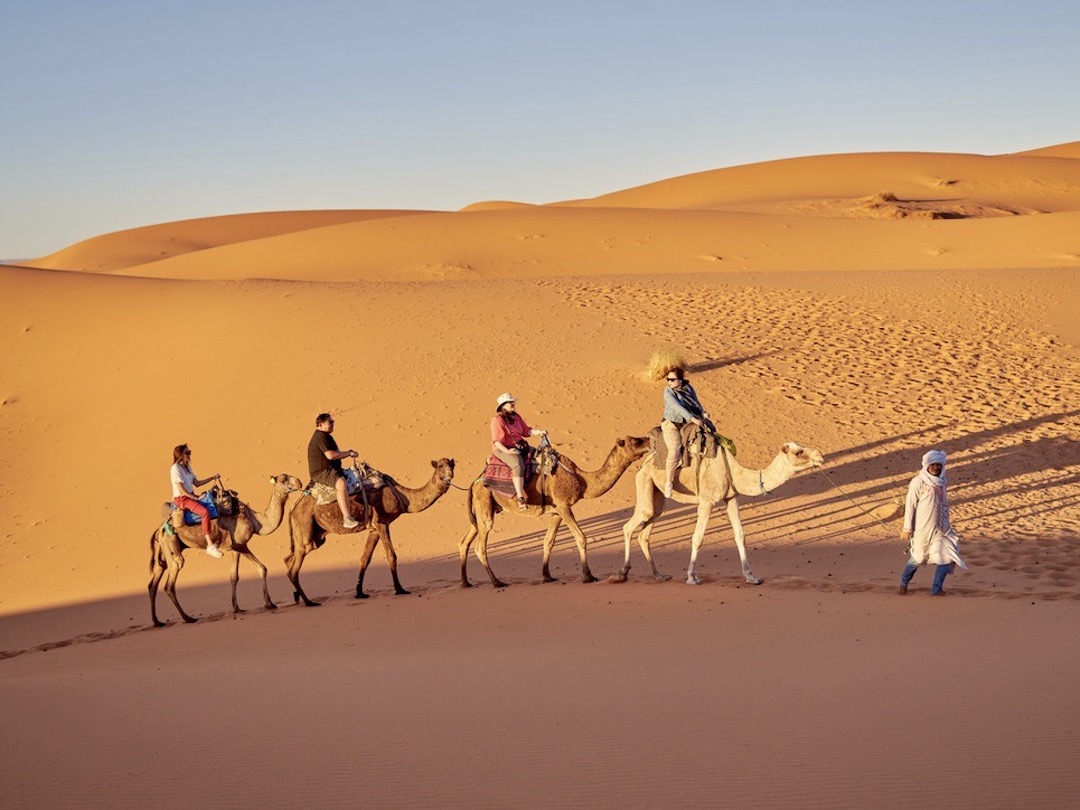 Camel riding in the Sahara desert with Other Way Round Travel