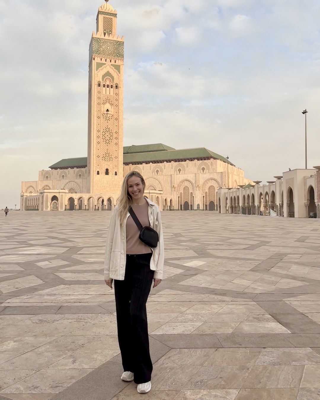 Amanda in front of the Hassan II Mosque in Morocco with OWR 
