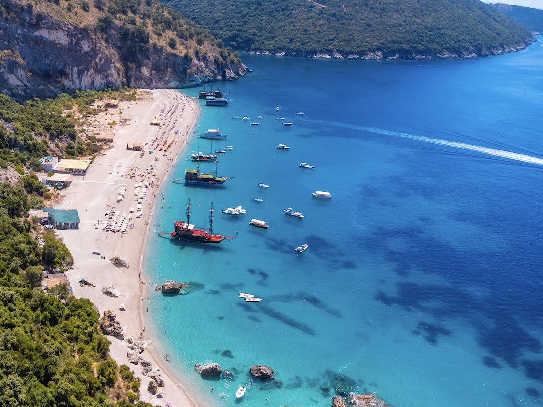 Aerial drone view of the paradise beach of Krorez in Sarande, during the Albania group tour with Other Way Round Travel
