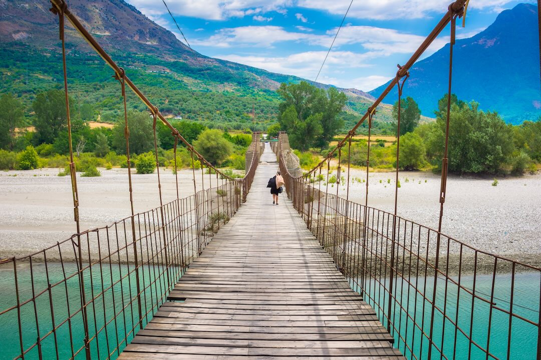 View of Vjosa river valley with bridge and city of Tepelena, during the Albania group tour with Other Way Round Travel