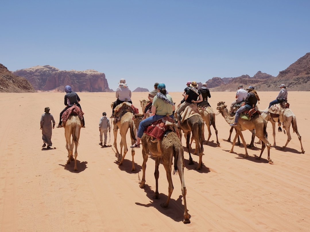 Trip on camels on Wadi Rum Desert during the Jordan group tour with Other Way Round Travel