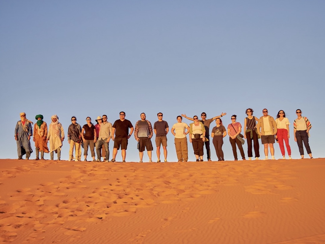 Group photo in the Sahara Desert, Morocco during the group tour of Central Europe with Other Way Round Travel
