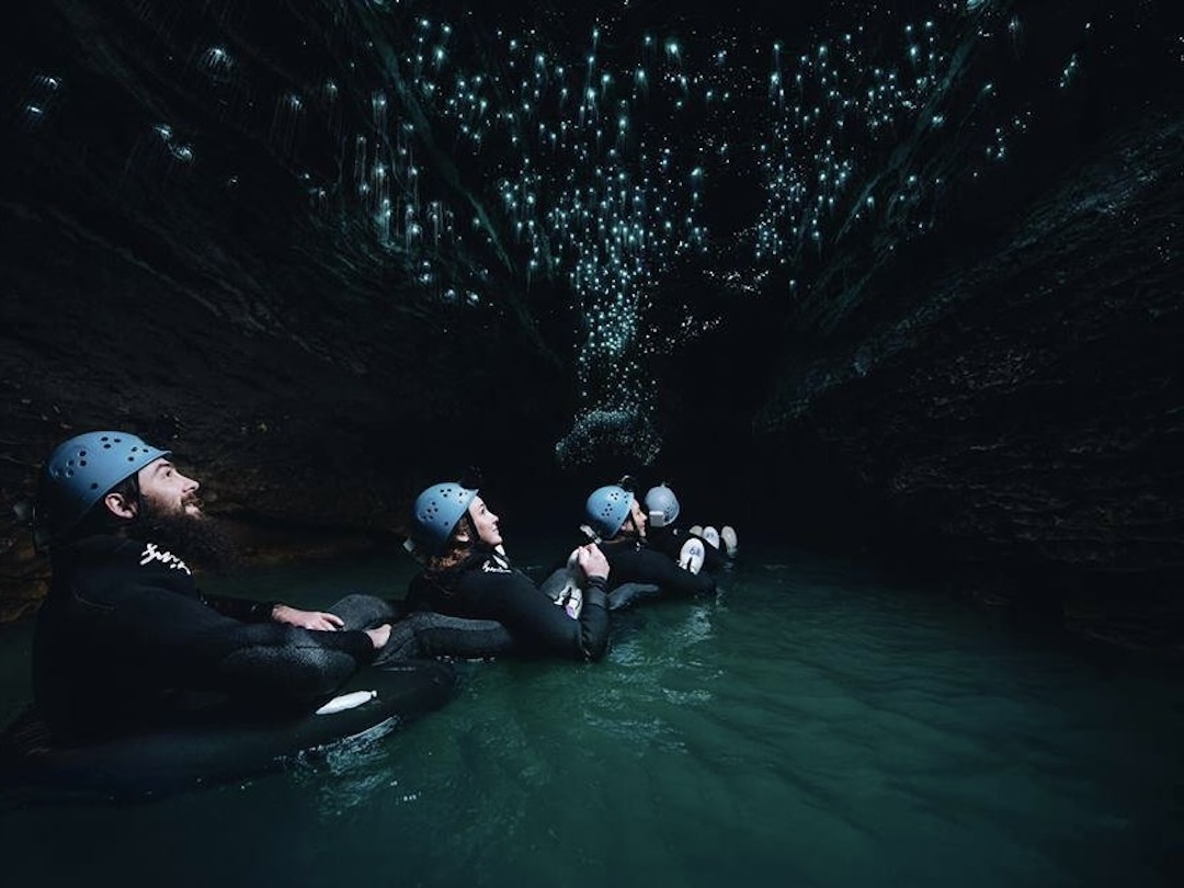 Black water rafting experience in Waitomo Caves during the New Zealand group tour with Other Way Round Travel