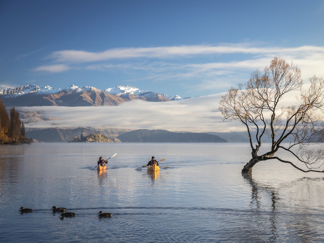 Kayaking on lake Wanaka during the New Zealand group tour with Other Way Round Travel